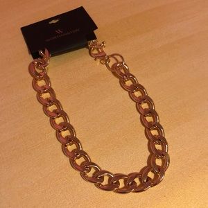 Gold chain link necklace.